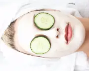 Girl witn facial mask and cucumber on her eyes