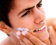 Man putting on shaving cream smiling