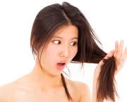 shocked woman watching the damage hair and splitting ends