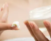 Skin care. Moisturizing cream in female hands